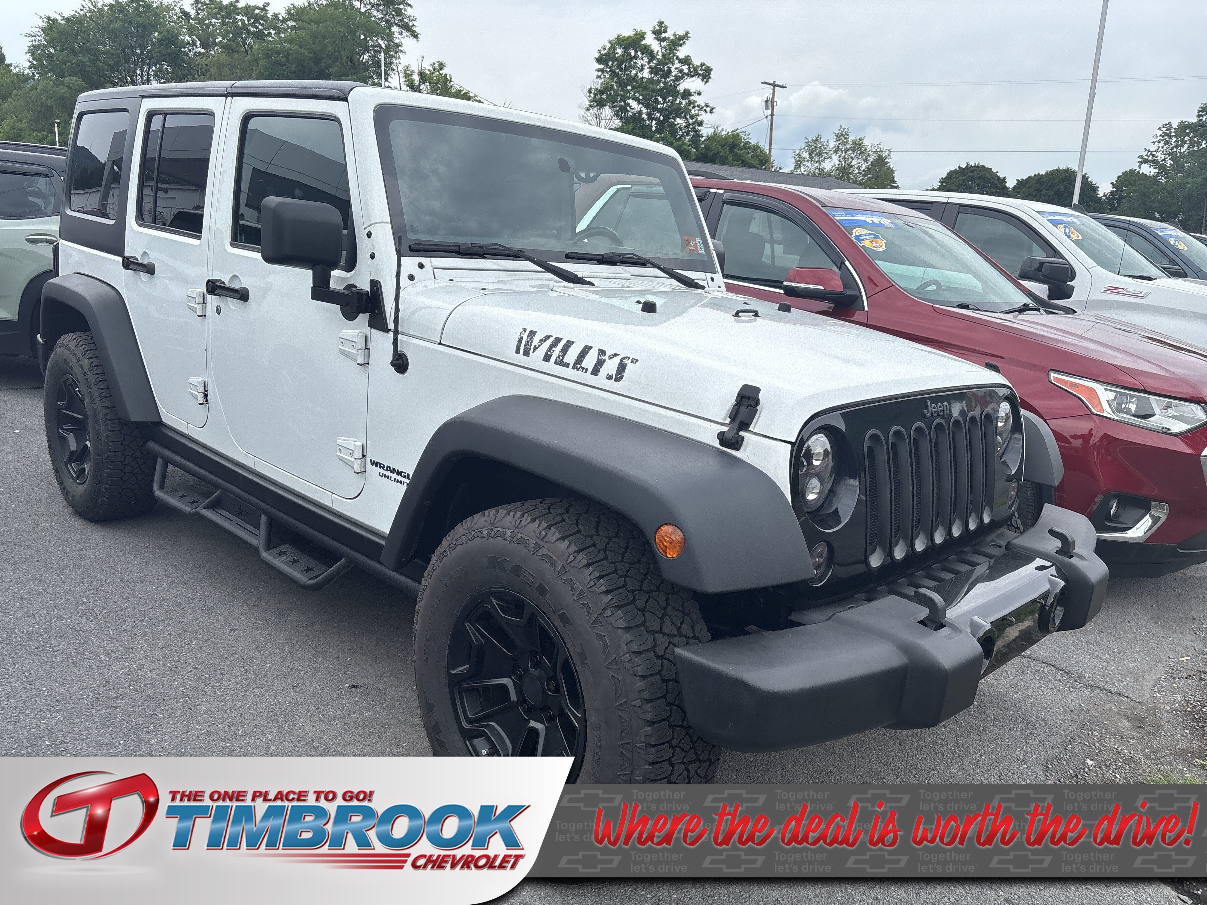 2016 Jeep Wrangler Unlimited Willys Wheeler in White — front three-quarter view