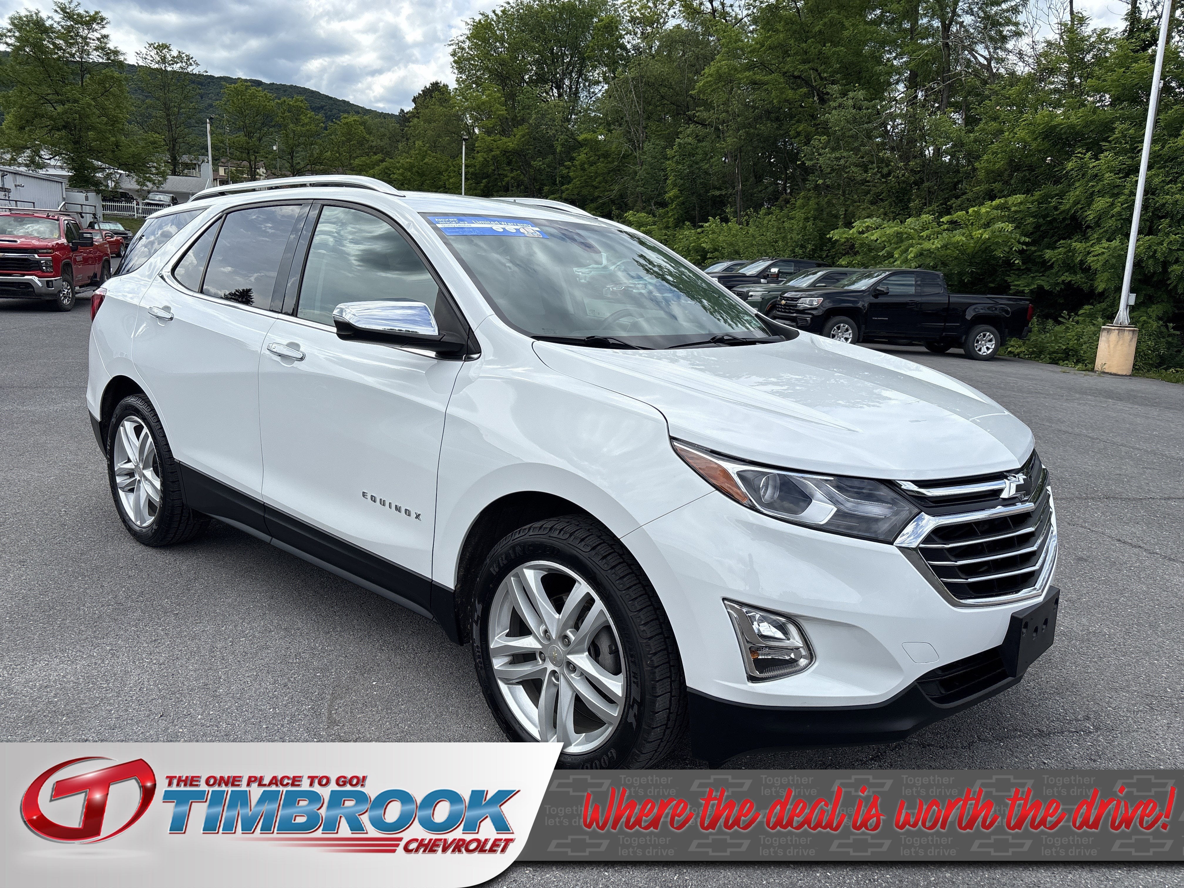 2020 Chevrolet Equinox Premier in Summit White — front three-quarter view